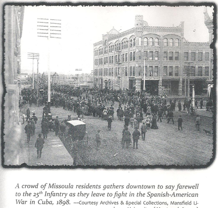 Crowd of Missoula residents gathers downtown to say farewell to the 25th Infantry as they leave to fight in the Spanish-American War in Cuba, 1898